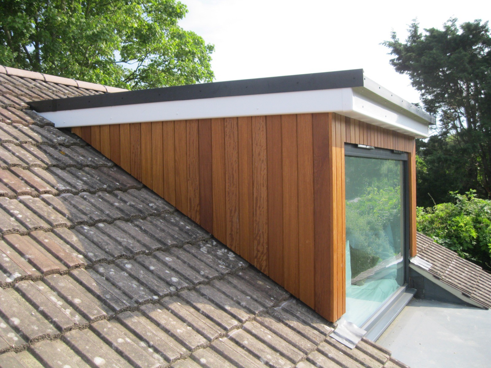 Modern dormer extension with cedar cladding