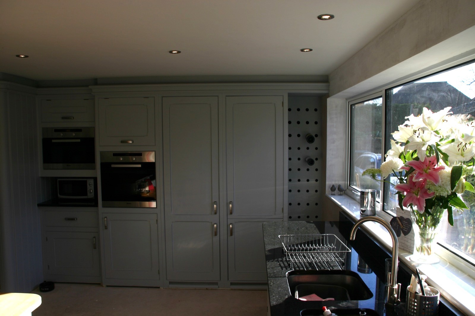 Fitted kitchen with painted cabinets and granite worktops